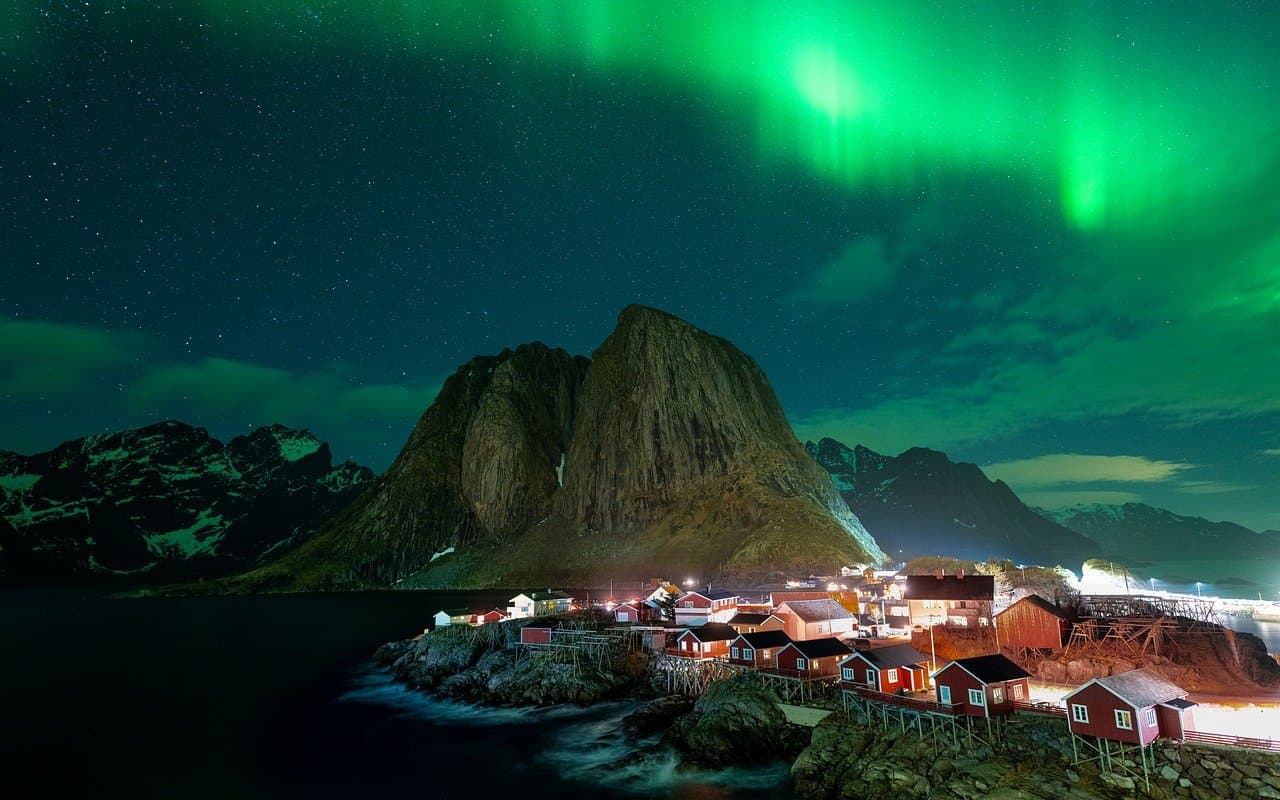 Northern lights over Nordic landscape